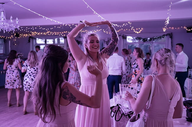 Bridesmaids dancing and celebrating during a Hampshire wedding reception